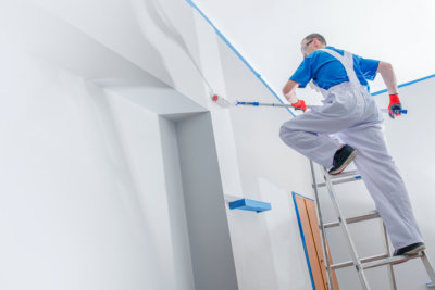 man painting on the wall